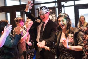 Guests walking the red carpet, having fun at Dance The Night Away, promo for guests with special needs.