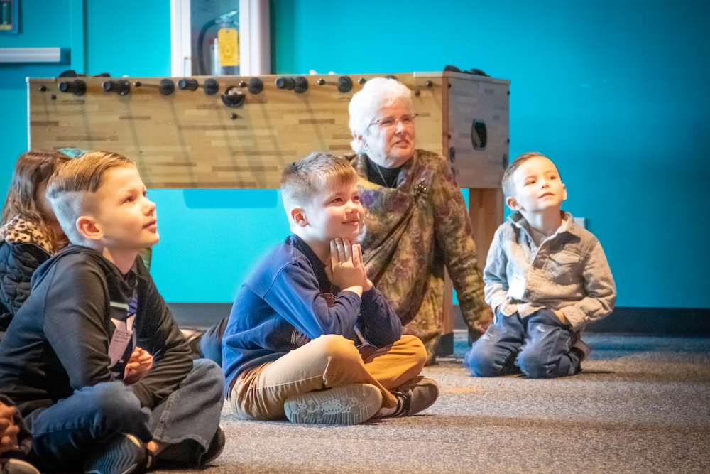 Elementary age students have fun and learn about Jesus in Kid Village at The Village Christian Church